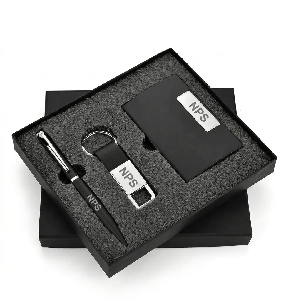 Customisable 3-Piece Executive Corporate Gift Set Black presentation box containing a matching matte black and silver pen, keyring, and business card holder set.