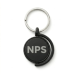Black metal keyring featuring a rotating central disk and a silver split ring, displayed against a plain white background.