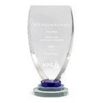 Clear custom crystal award shield featuring an engraved corporate logo and recognition text on a sturdy tiered base.