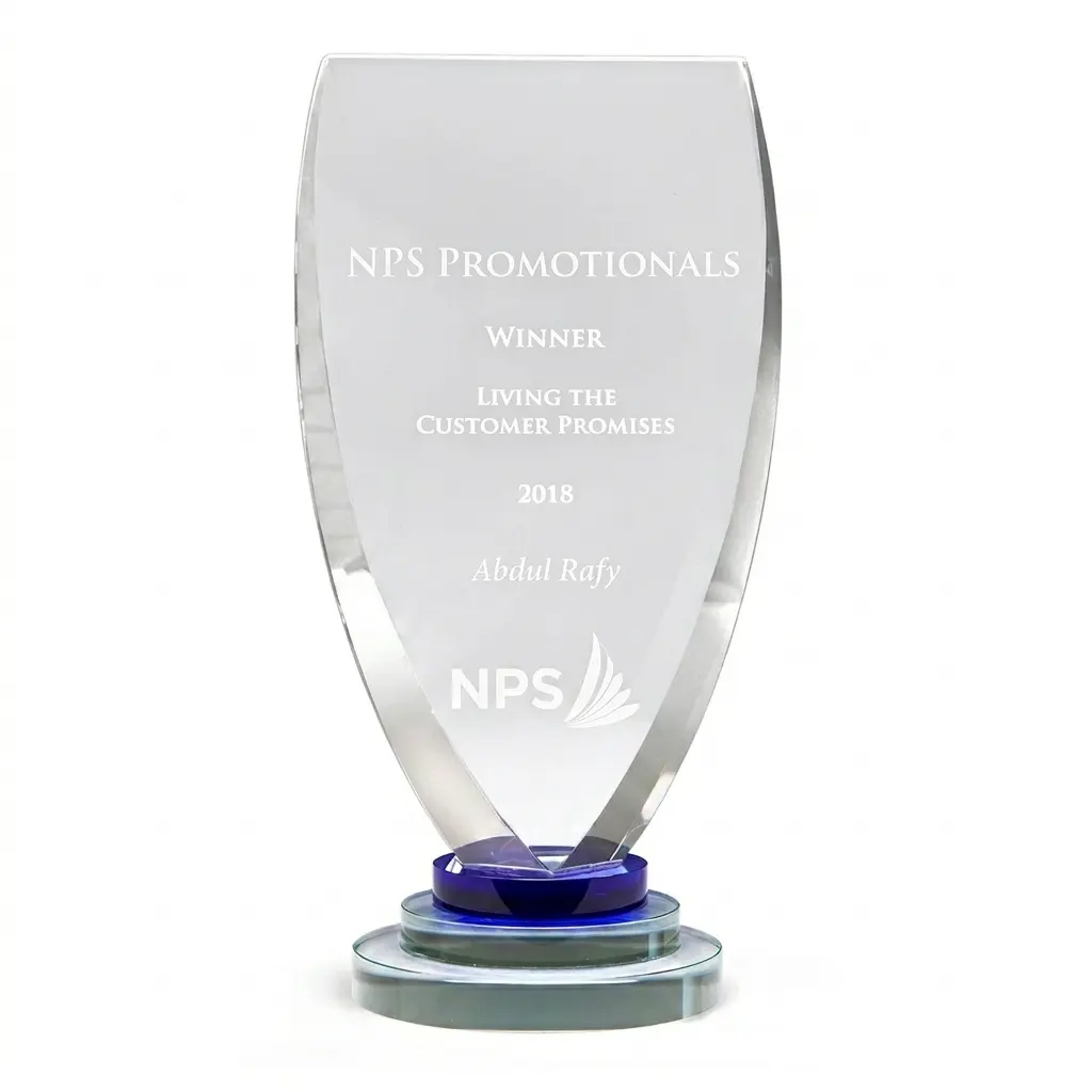 Custom Crystal Corporate Award Shield Clear custom crystal award shield featuring an engraved corporate logo and recognition text on a sturdy tiered base.