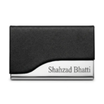 Black faux-leather and polished stainless steel business card holder featuring custom engraved text on the metal base.