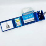 Blue folding desk organizer with a pen holder, flip calendar, memo pad, coloured sticky notes, and custom branding space.