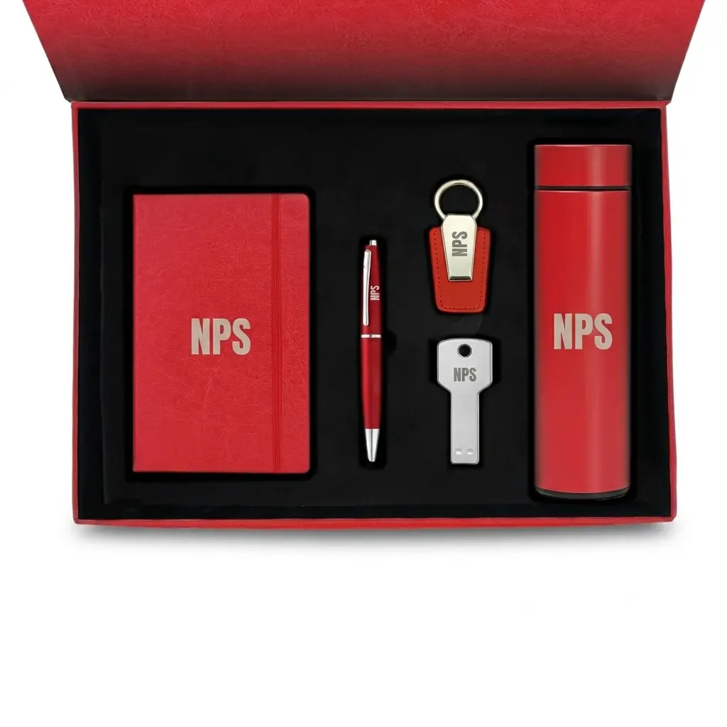 Red 5-piece corporate gift set in a presentation box featuring a custom branded notebook, thermal flask, pen, keychain, and key-shaped USB drive.